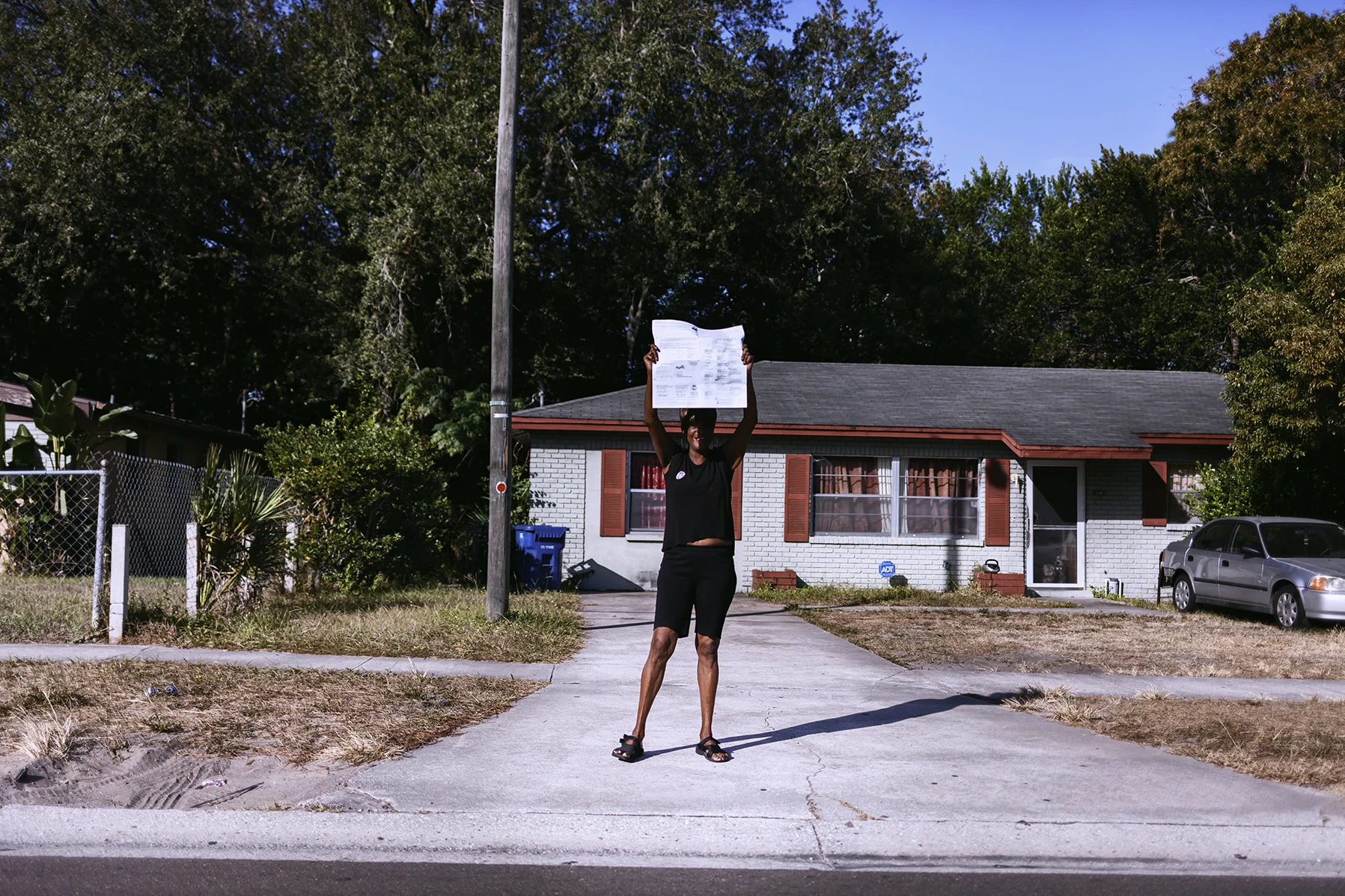 "May God bless us today", the women screamed as she held an election ballot. Front house wars. Tampa, Fl. 2016
