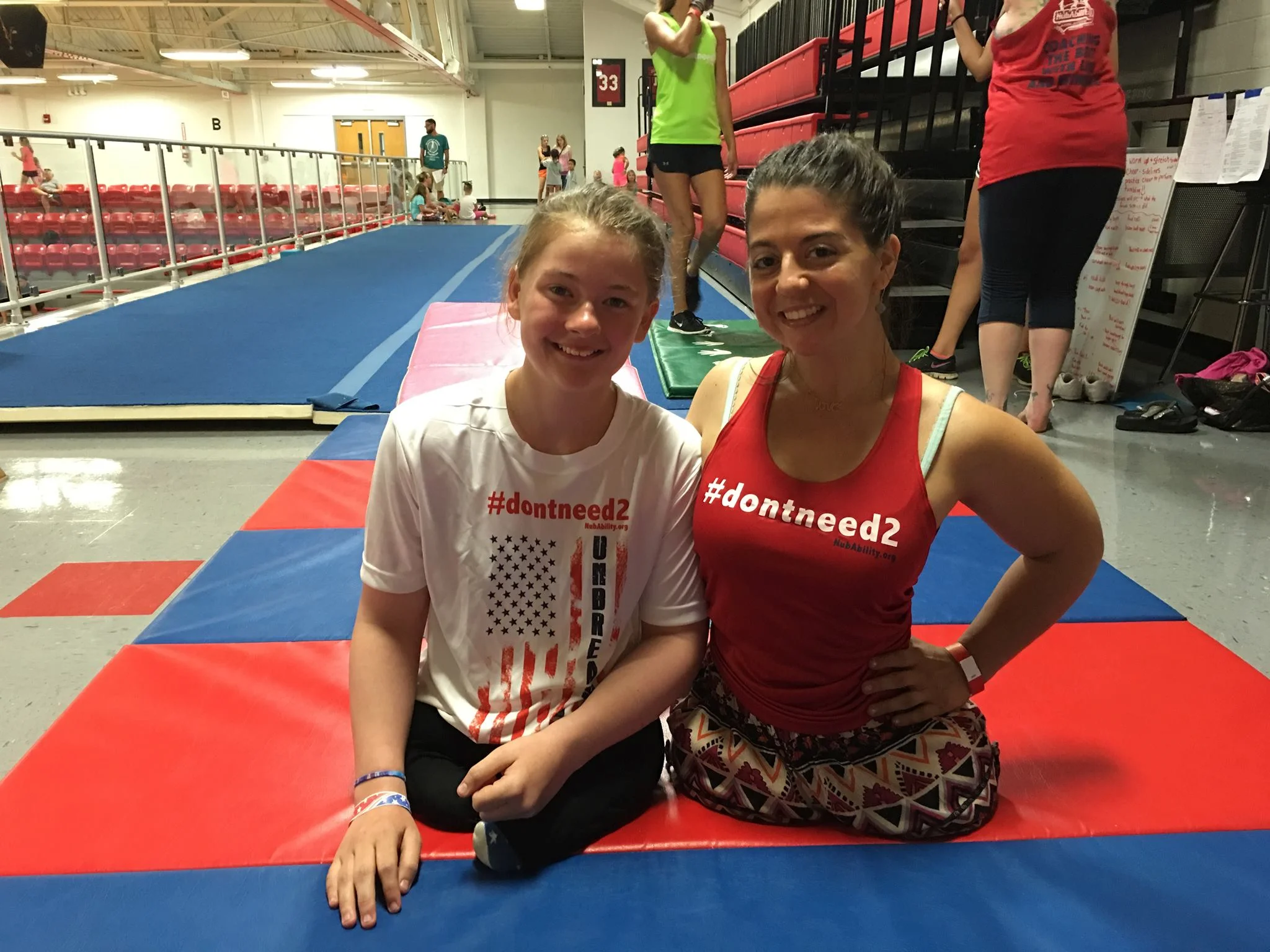 Jess with Olympic acrobat Jennifer Bricker at NubAbility Athletics camp
