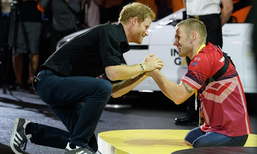 Mark with Prince Harry after the claiming silver medal in the rowing at the Invictus Games, 2017.