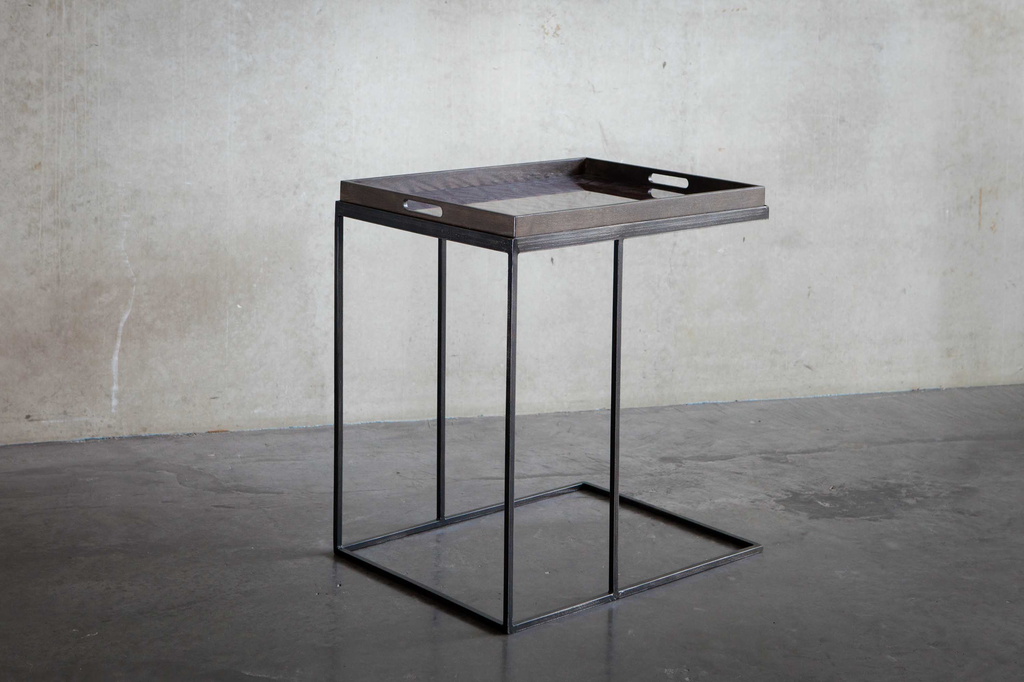 Designer sofa shop tables and Ethnicraft beds.