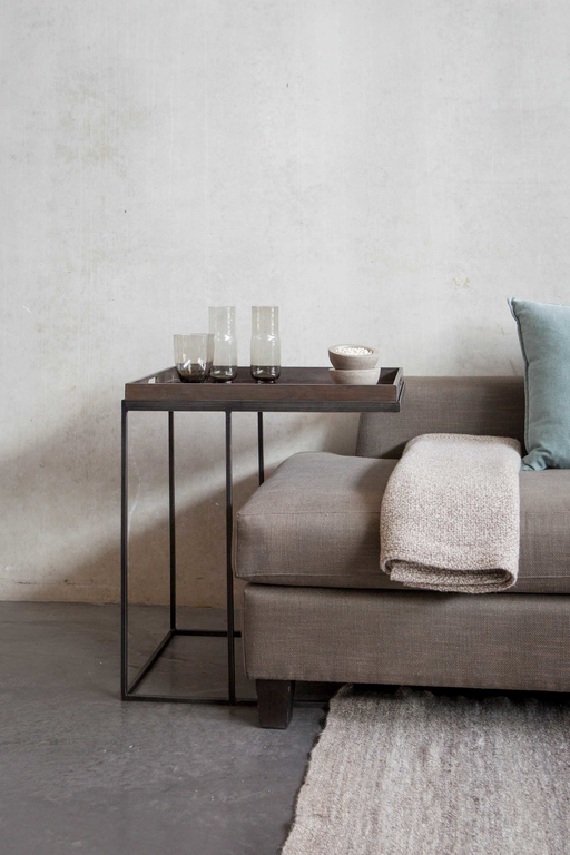 Designer sofa shop tables and Ethnicraft beds.