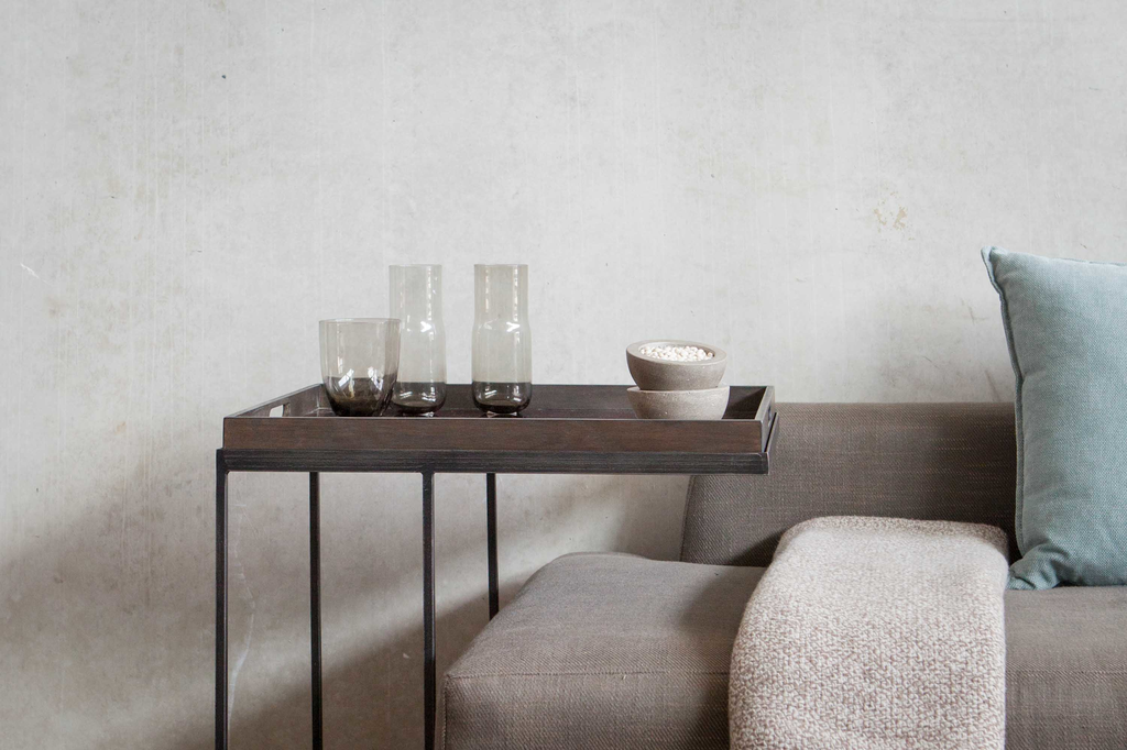 Designer sofa shop tables and Ethnicraft beds.