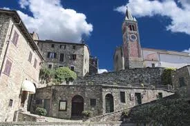 Ambra. A perfect Tuscan small town a piazza at its heart with a bar to watch the world go by. You can visit the church, eat lunch or dinner and window shop.