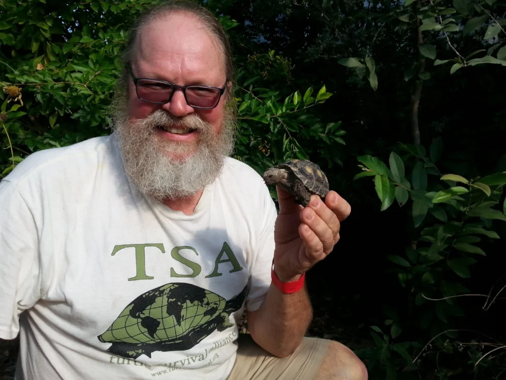 George L. Heinrich with a large juvenile Texas tortoise ( Gopherus berlandieri ; Hidalgo County, Texas). Photograph by Carl J. Franklin.