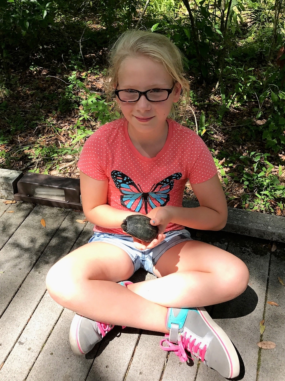 Chloe holding species #43 for The Big Turtle Year, an adult female striped mud turtle ( Kinosternon baurii ) at Brooker Creek Preserve (Tarpon Springs, Florida). Photograph by Andrew Farren.