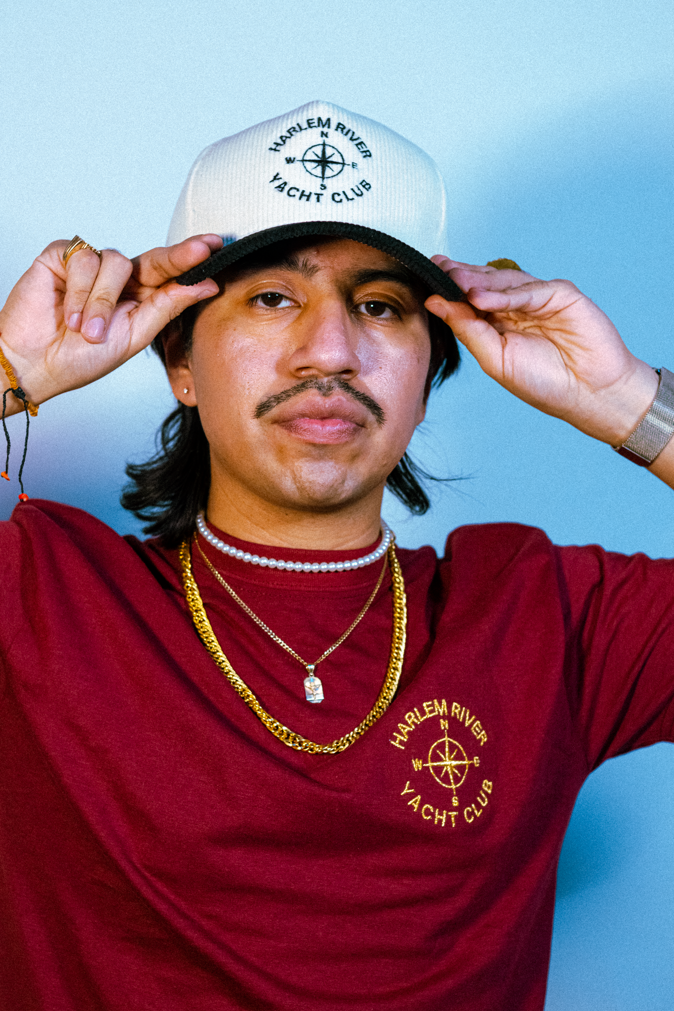 JT holding that hat front wards with sauce