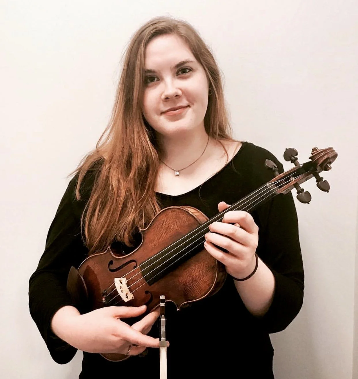 Ann Frances holding a violin