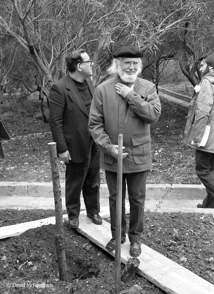 During the conference the group, including the Nicaraguan poet Ernesto Cardenal (front) planted olive trees on the Peace Lab property, the center that hosted the conference. The Peace Lab takes in refugees today. Fr.Dionysius Mintoff, a franciscan friar and Peace Lab founder, is behind Cardenal.