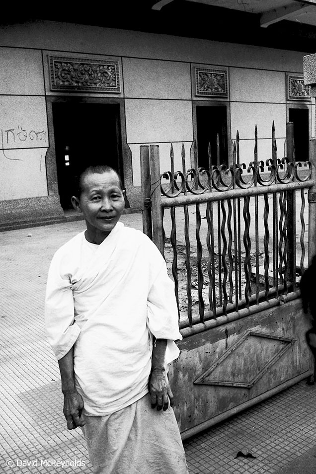  Nun in front of a burned out temple. 