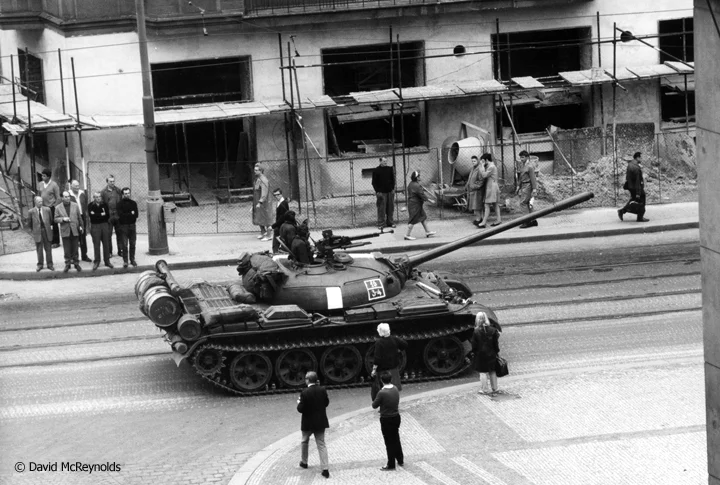 "Prague was to be my holiday, four days between two conferences." On David's last morning in Prague, August 21, 1968, Soviet tanks rolled into the city and David captured some of the action from his hotel window and in the streets.