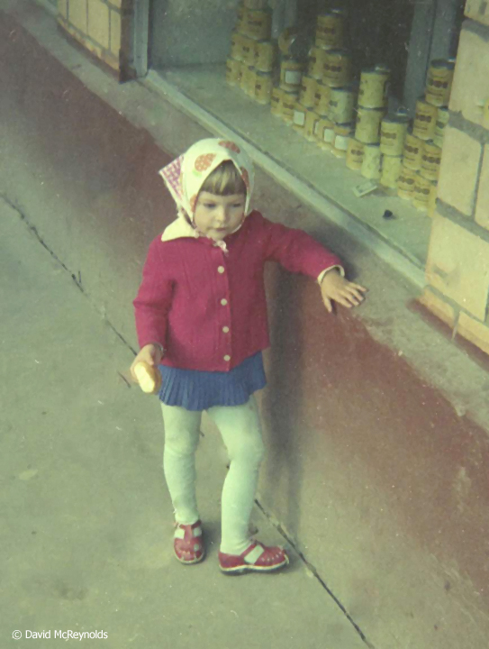 Child in front of a bakery. David likes to emphasize the humanity of “the enemy.”