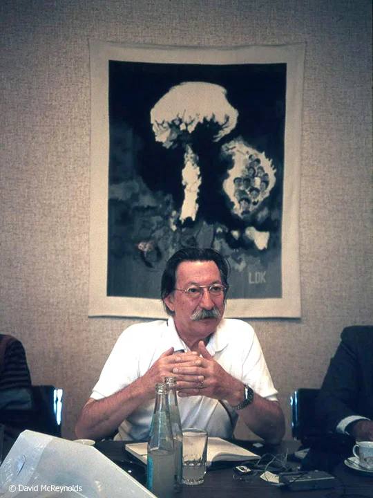 SU1987-man-with-bomb-poster-behind_web.jpg