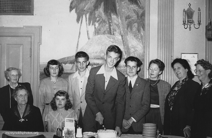 David, cutting cake, launched into activism with the Youth Temperance Council of which he was the Southern California Chapter President. His brother Martin is on his right. 1948.