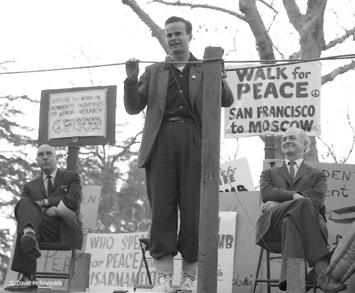 Left, Rev. Stephen Fritchman, Unitarian minister in Los Angeles welcomed the crowd. Brad Lyttle, speaking, was the key organizer of the walk and explained the purpose to the crowd. Eminent scientist Linus Pauling, seated right, spoke of the da