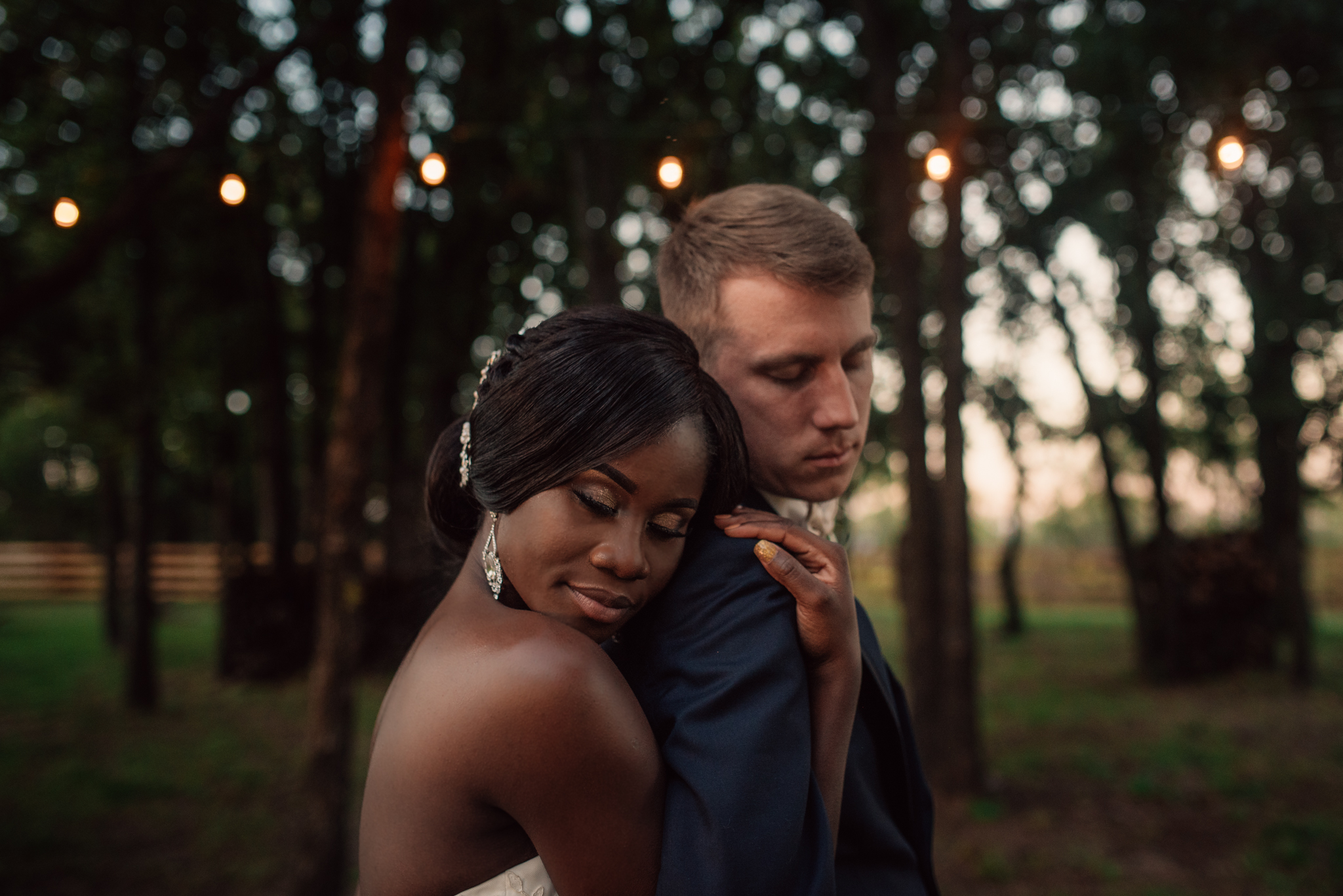 Texas Bride and Groom embracing for a photo during a Texas Sunset in Brownwood, Texas