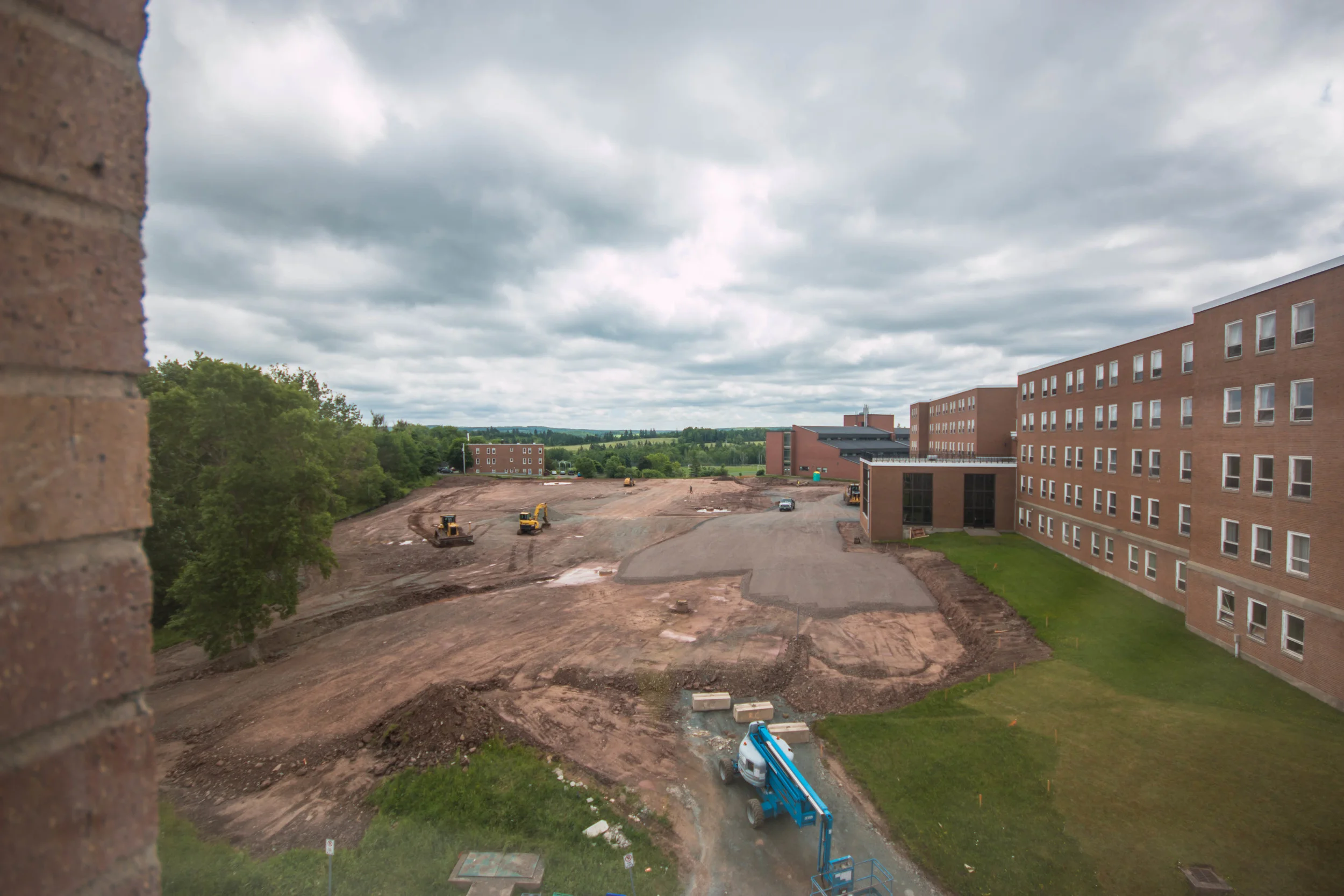 The view from a top floor lounge of MSB, depicting the ongoing expansion of the Lane Hall Parking lot. 