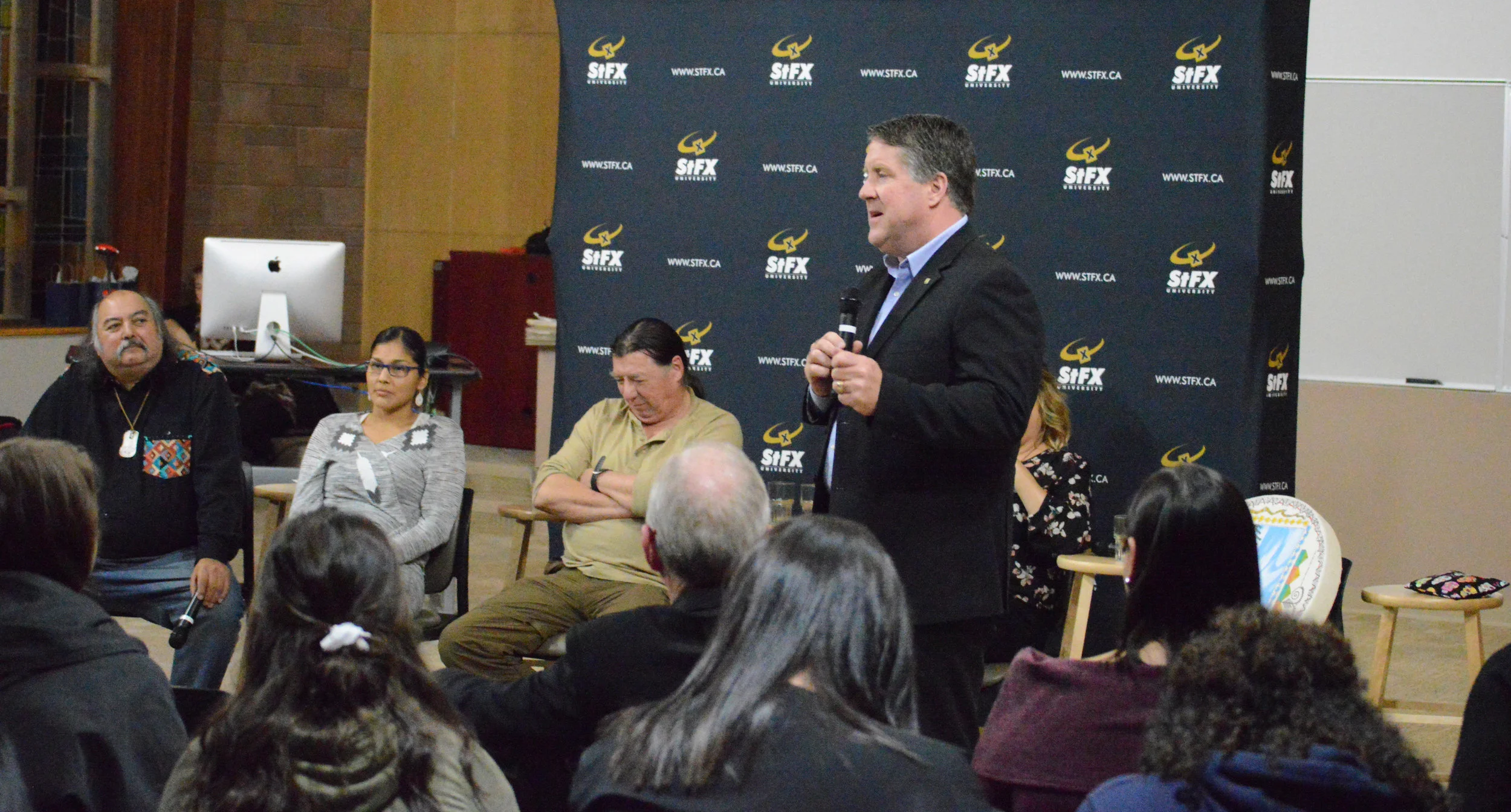  Dr. Kent MacDonald delivers his concluding remarks at the President's Colloquium on Social Justice for Reconciliation on Nov 3. Panelists, from left to right, included Alan Syliboy, Molly Peters, Kerry Propser, and Cheryl Maloney. 