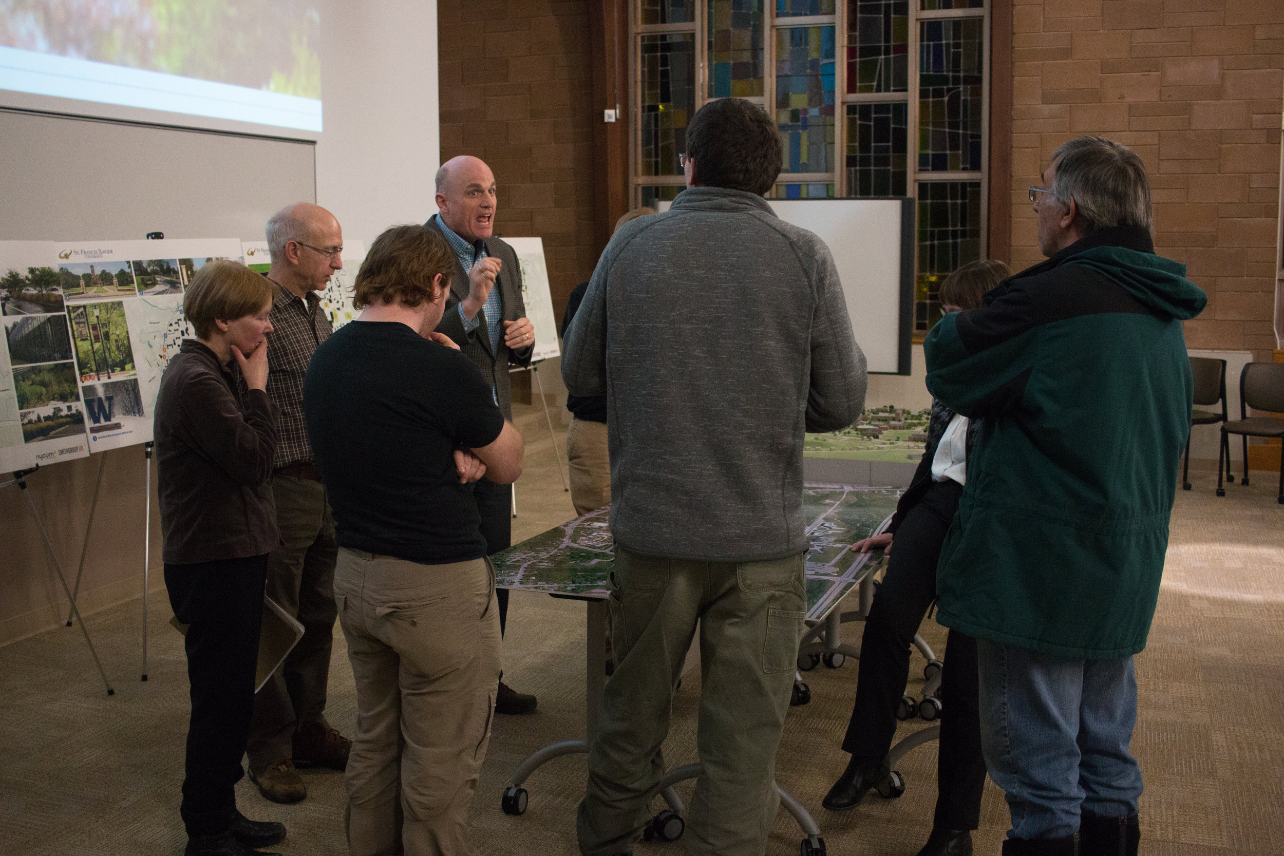  Director of Facilities Management Leon MacLellan discuss the Framework Plan with members of the StFX Biology Department.&nbsp; 