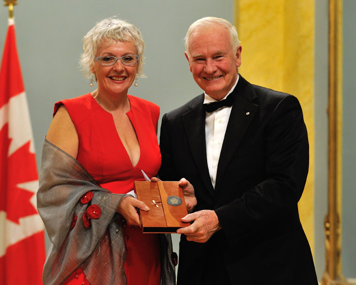 Catherine banks received a specially bound copy of her play, it is solved by walking, from governor general david johnston after winning the 2012 governor general literary award for drama. photo: dany veillette / Rideau Hall (The Walrus). 