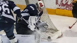 Marchand stuns Varsity Reds