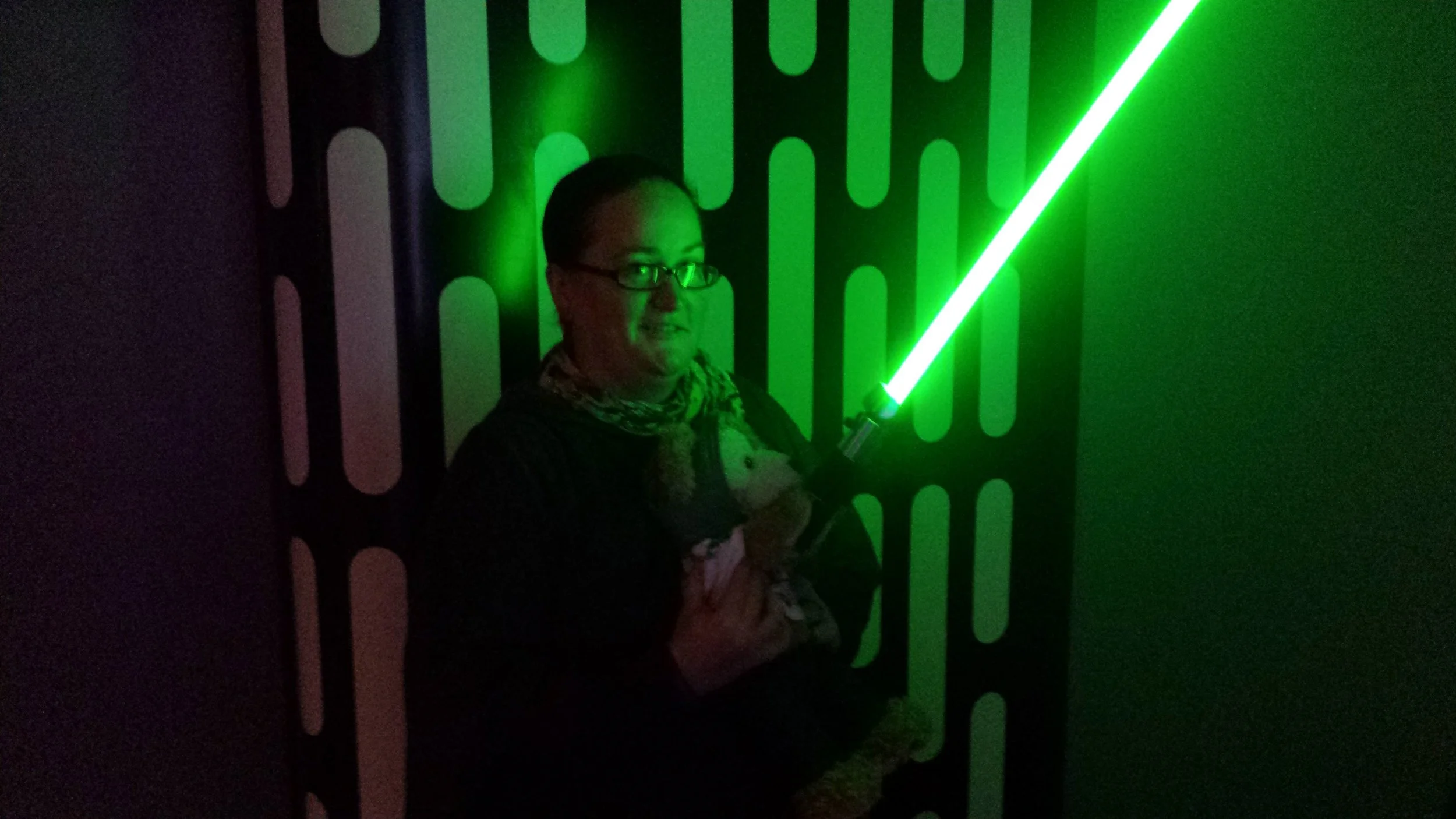 Duffy holds a light saber.