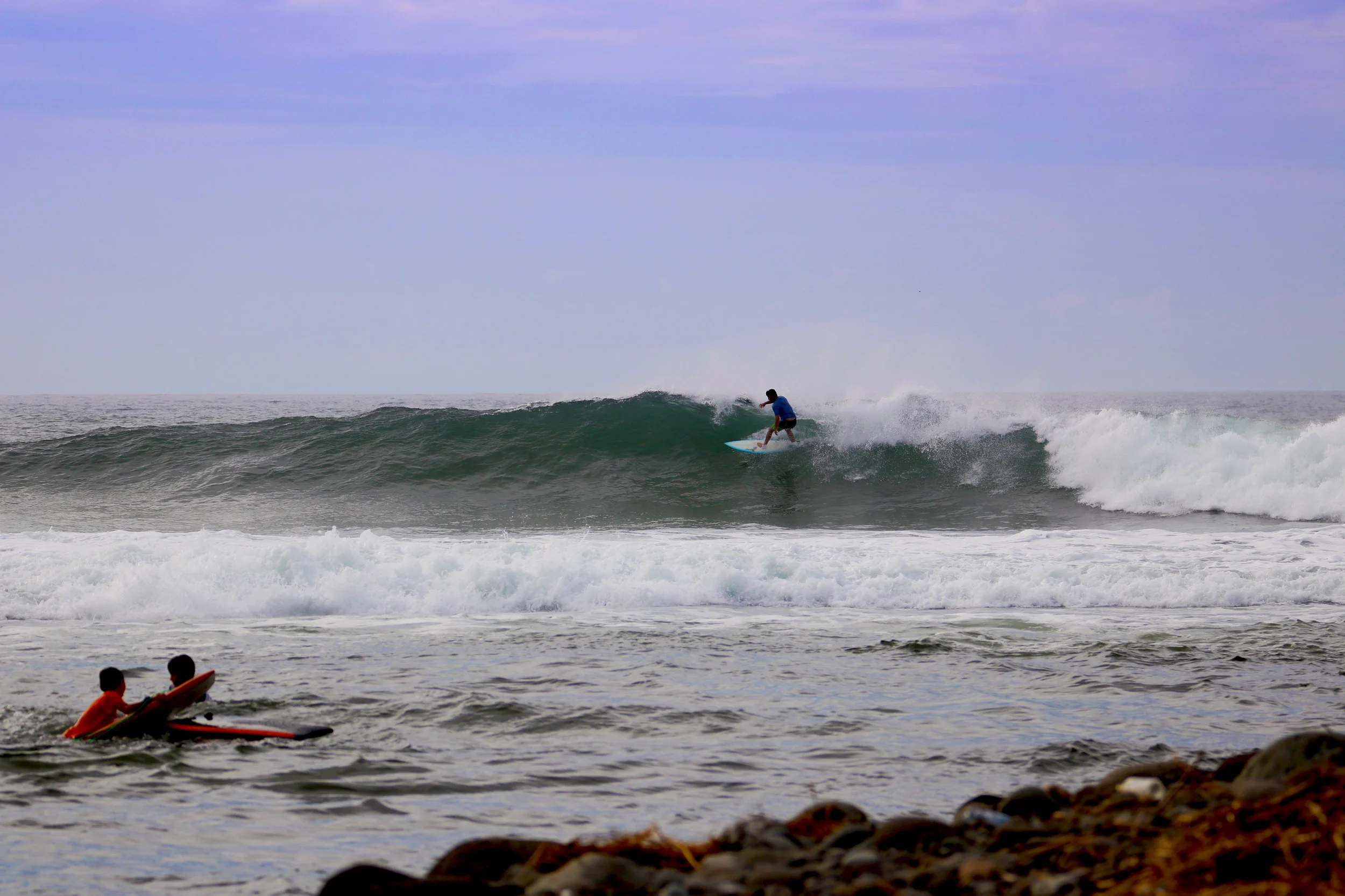 Sharing a few waves with the locals.