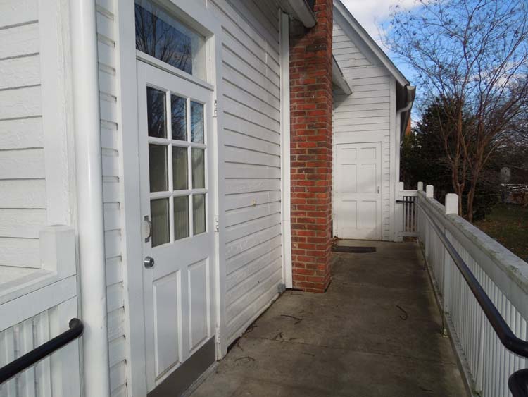 Handicapped ramp leads to rear exit door. 