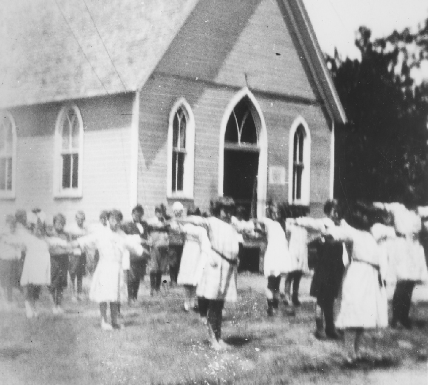 School class exercising in the Community House yard about 1920