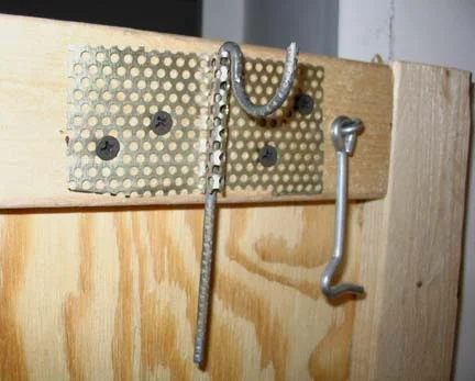 Hangers turn sideways to permit folding the peris.