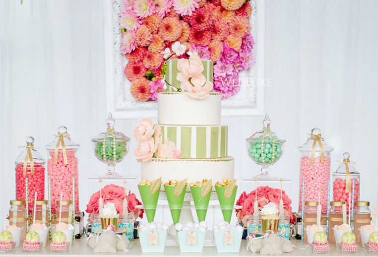 Colourful wedding cake and sweets display
