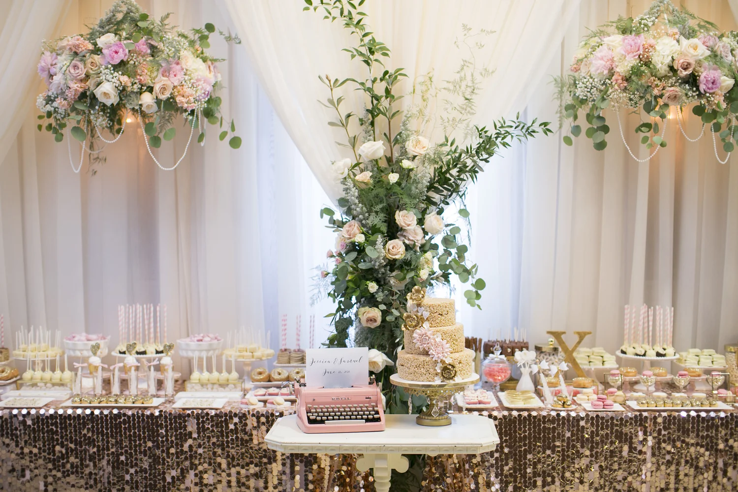 Floral wedding cake and dessert table