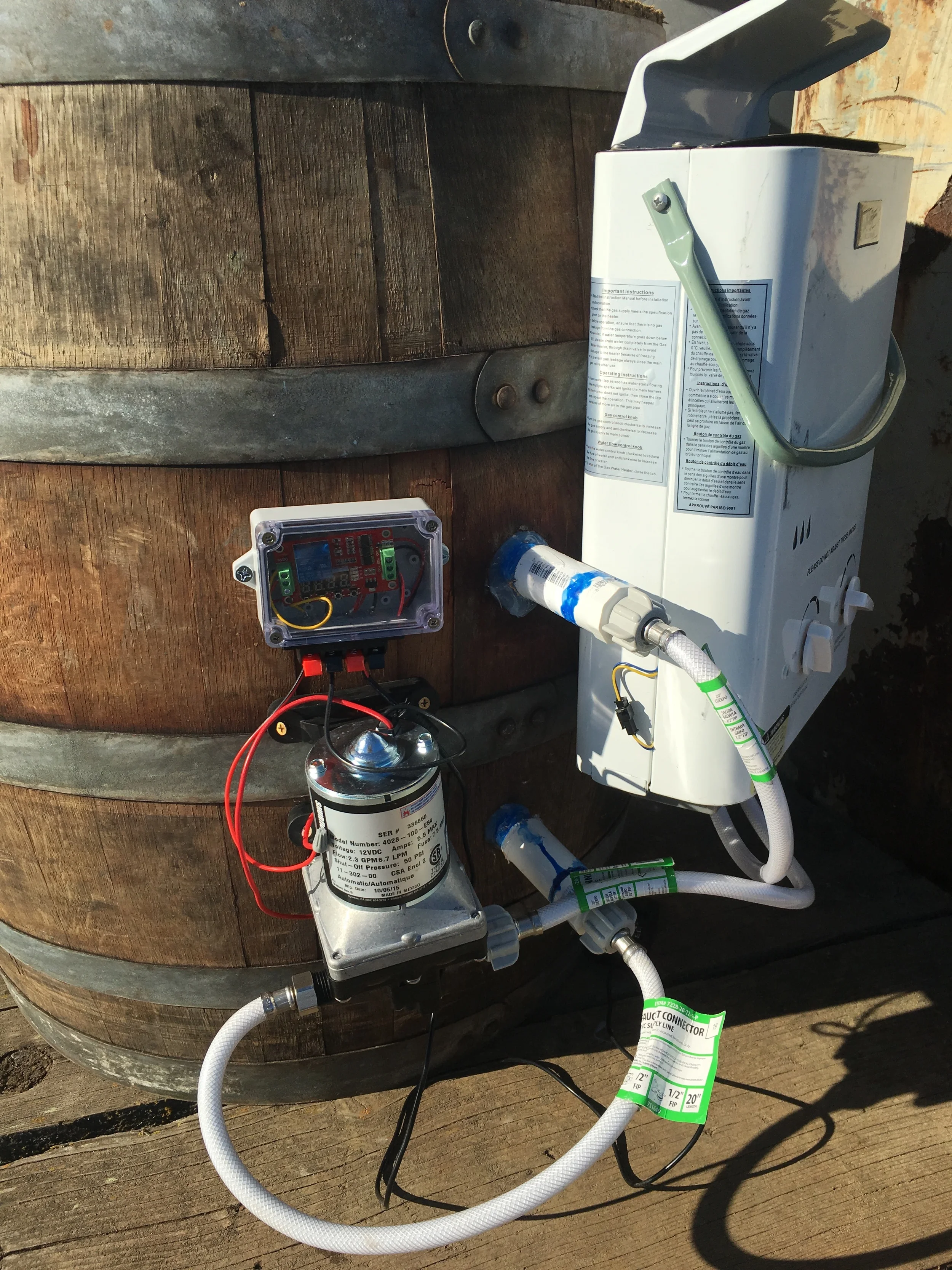 The whole system is powered by a 12v dc pump, which pulls water from the supply inlet, pushes it through a filter, and through a pressure-activated propane water heater, which returns hot water into the tub through the return inlet. The pump is controlled by a relay, which is activated by a temperature-reading micro-controller that is connected to cellular signal (and therefore can be triggered on remotely).