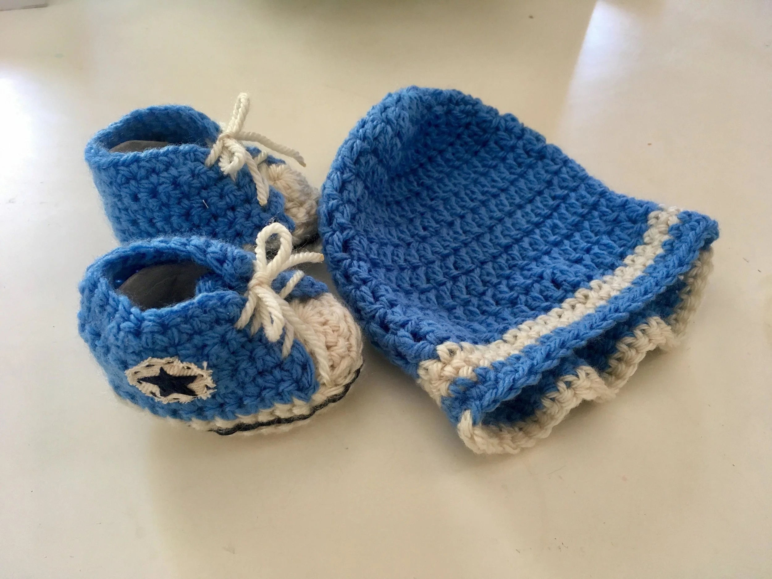 Hand knitted booties and beanie by Abuela (grandma!)