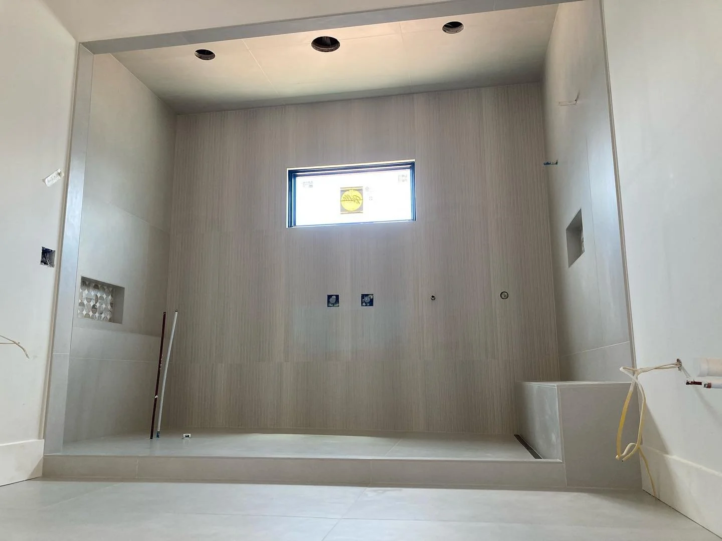 This is a tub/shower combo that we just finished up in Lexington for Young&rsquo;s Contracting. We had KBRS fabricate a custom shower tray.  We also used Schluter&rsquo;s new Vario linear drain to create a clean one piece drain.