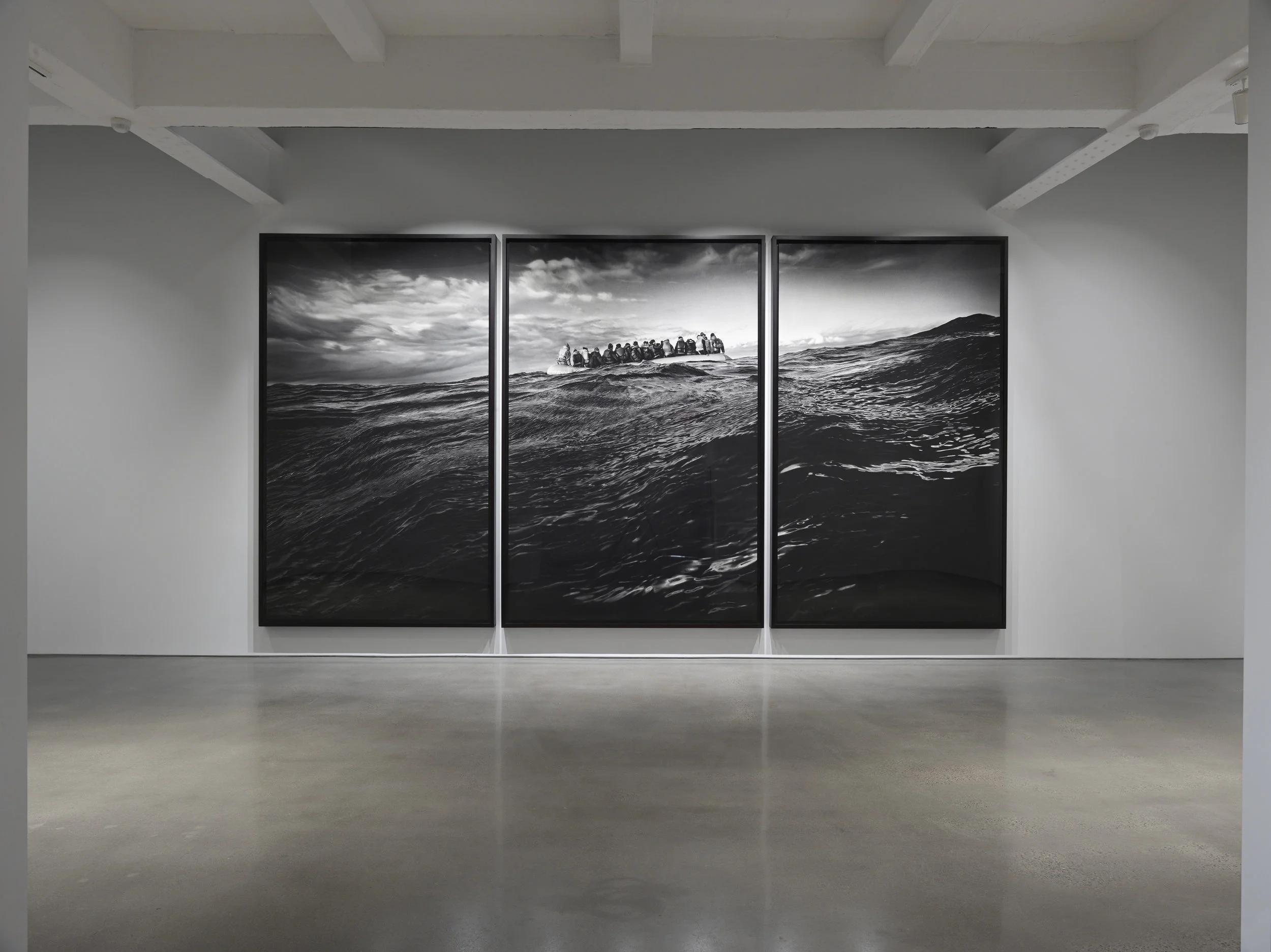 Robert Longo, Untitled (Raft at Sea) , 2016. Charcoal on mounted paper, 140 x 281 inches (355.6 x 713.7 cm) overall. Courtesy of the artist and Metro Pictures, New York