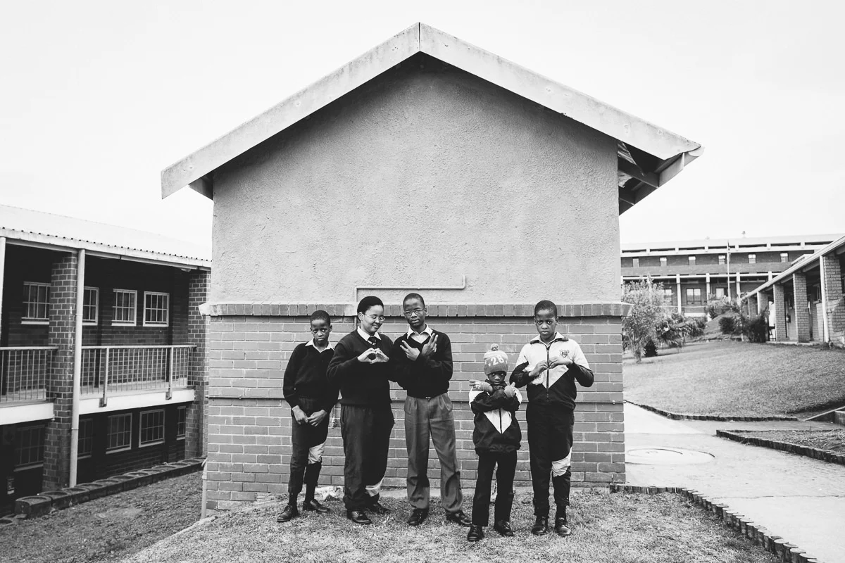 4 boys and 1 girl in the same family, including a set of twins, who are all completely deaf attending the school.