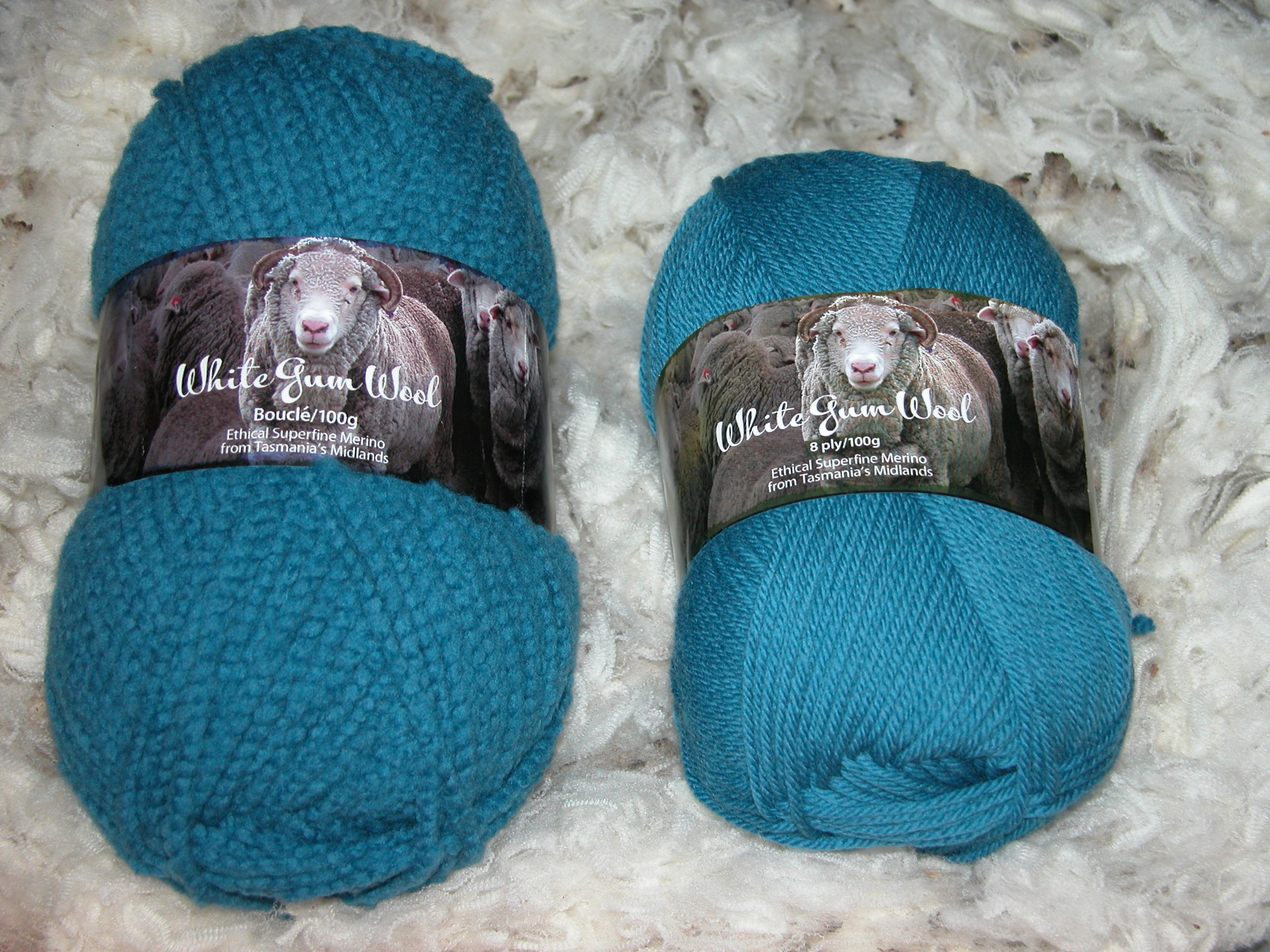 Big brother boucle next to standard 8-ply (DK) in fairy wren