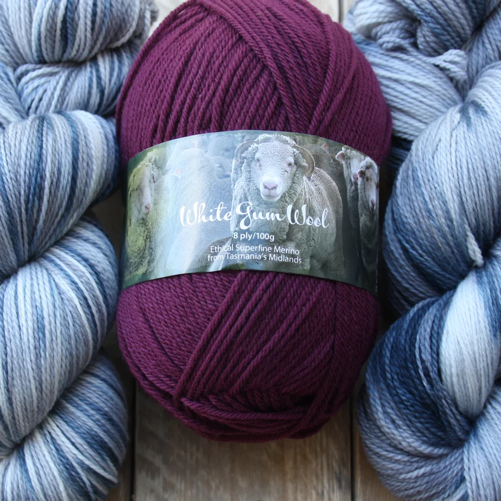 Pebbly beach with flax lily