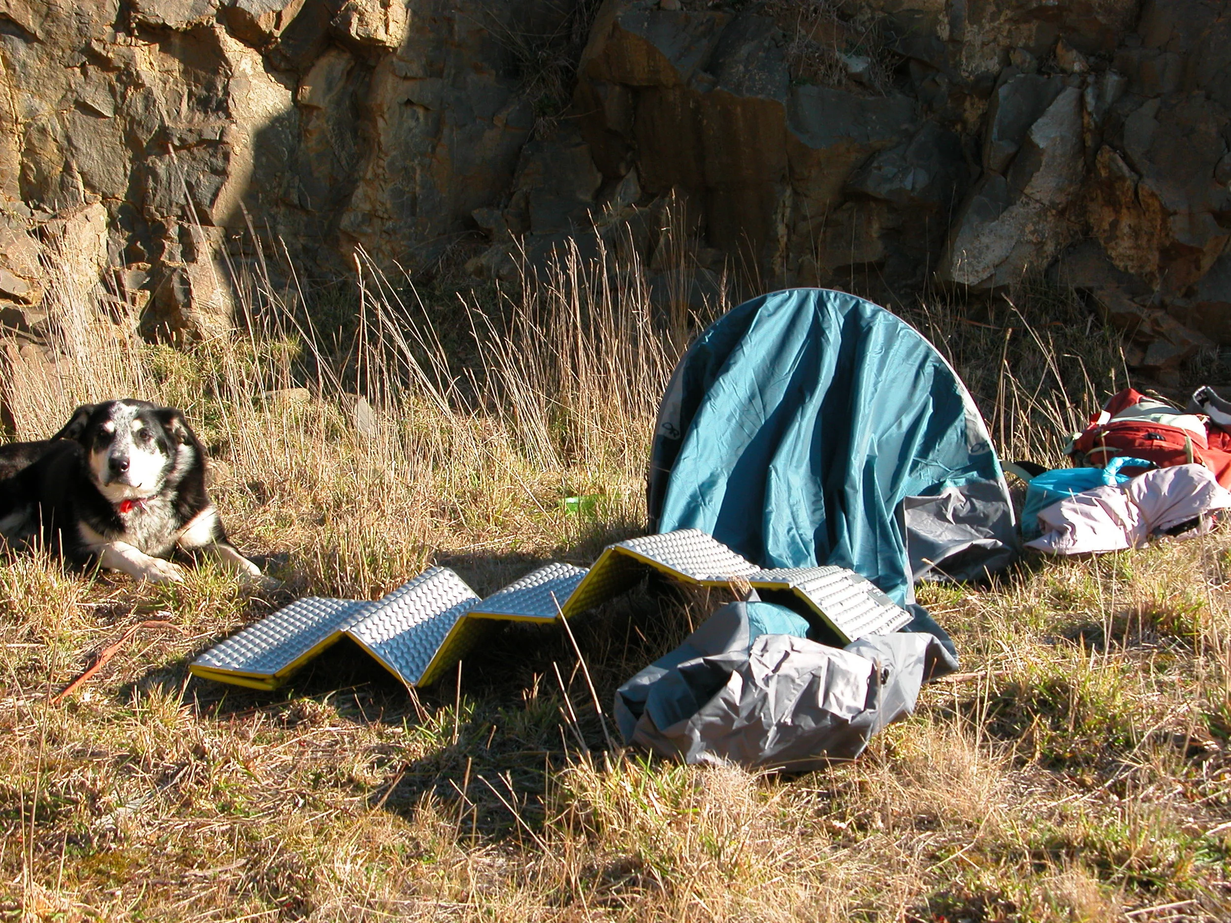 Chance guarding the “bivy bag” and the new thermal pad. We’re hunkered down in the quarry, trying to stay out of the westerly gale.
