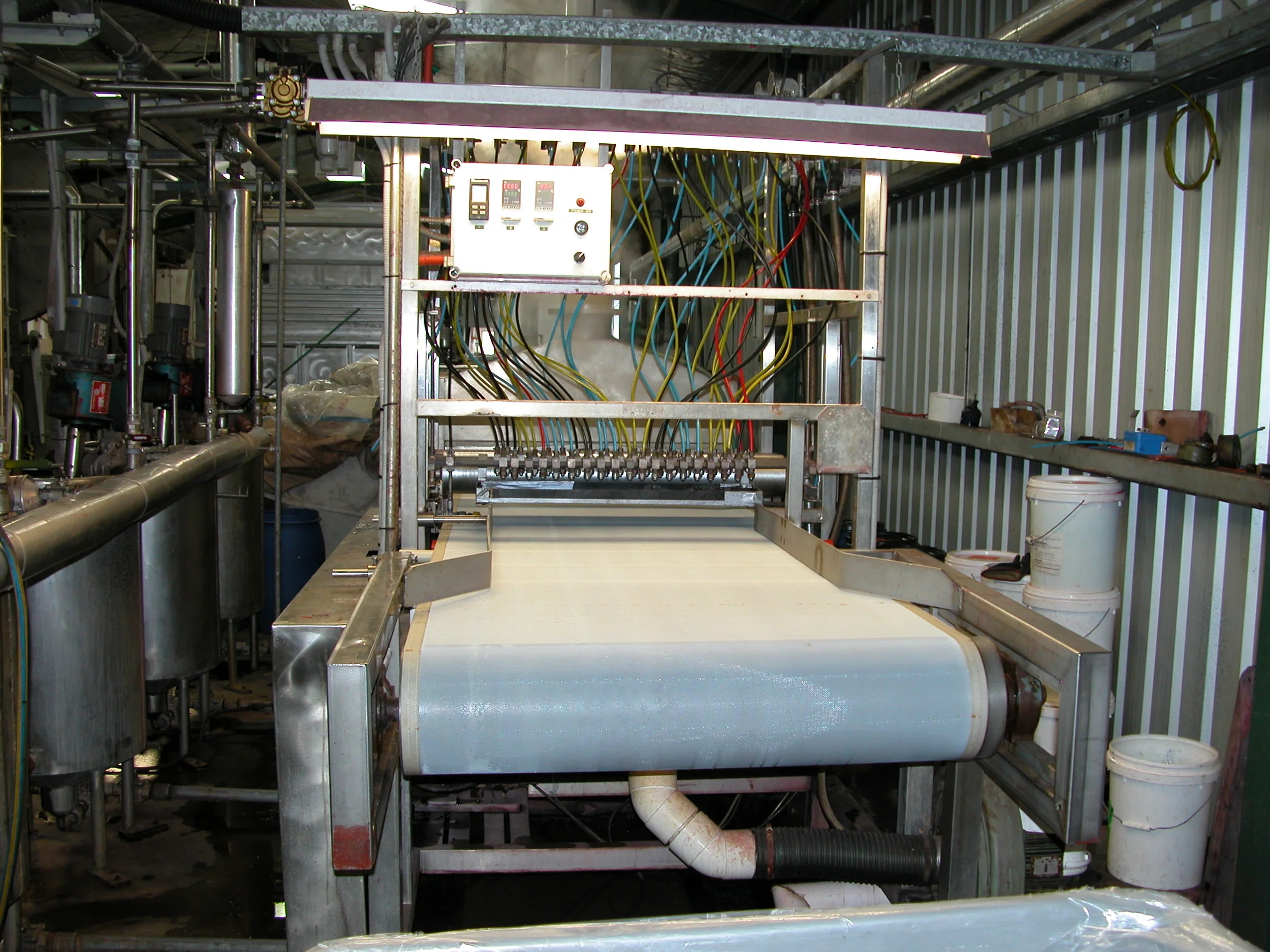 …and this is Design Spun’s machine for multi-dyeing. Each nozzle can squirt one of 4 different colours, a much more constrained system than hand-dyed. Peter Chatterton, one of the DS partners, started in the textile business as a lad in the dye house of major plant in the UK, and his incredible eye for colour and knowledge of what will (or won’t ) work, makes it possible for him to recreate Rebecca’s designs. Full points on Ashmore, Chatty!