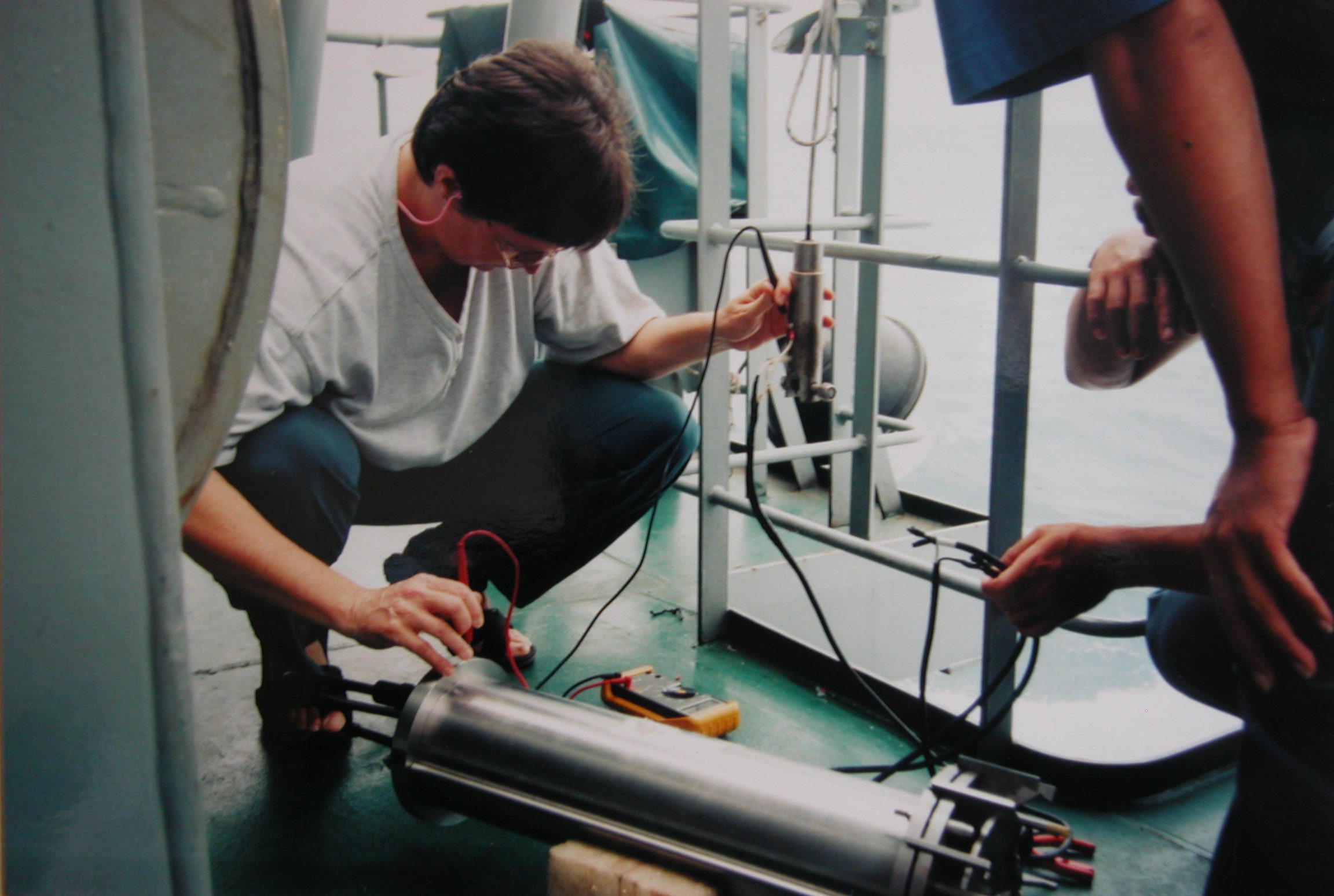 Testing the tethered instrument before preparing it to launch, aboard an Indonesian Navy research vessel near Timor (1996)
