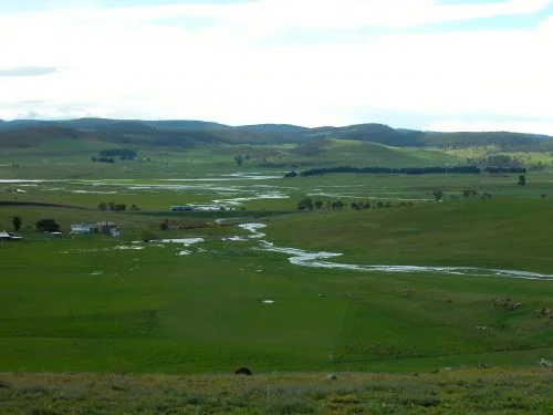 P2: Curly Sedge Creek flowing into the valley beyond. You can see the standing water in the Road Paddock.