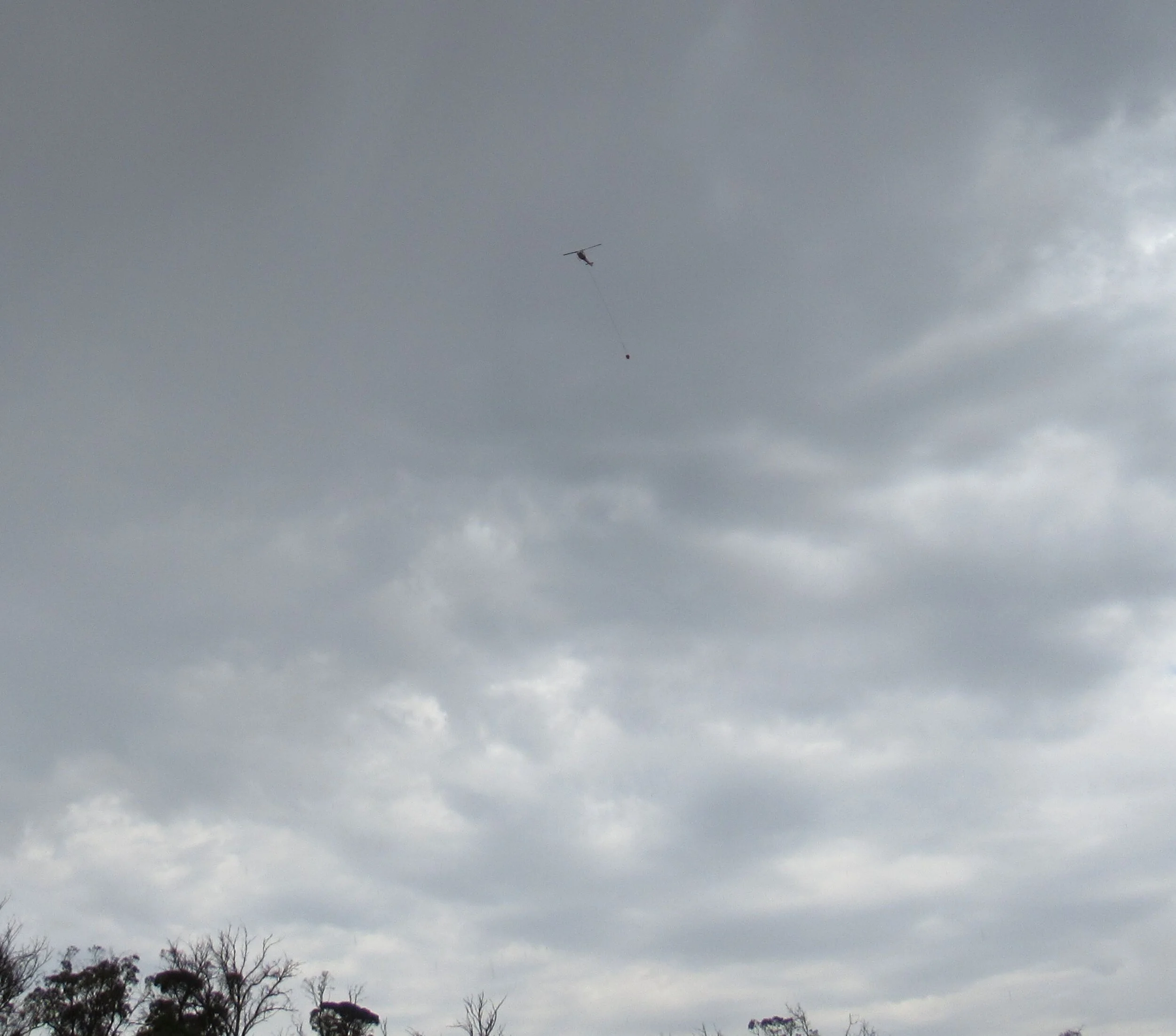 Water-bombing helicopter above the January 2019 fire.