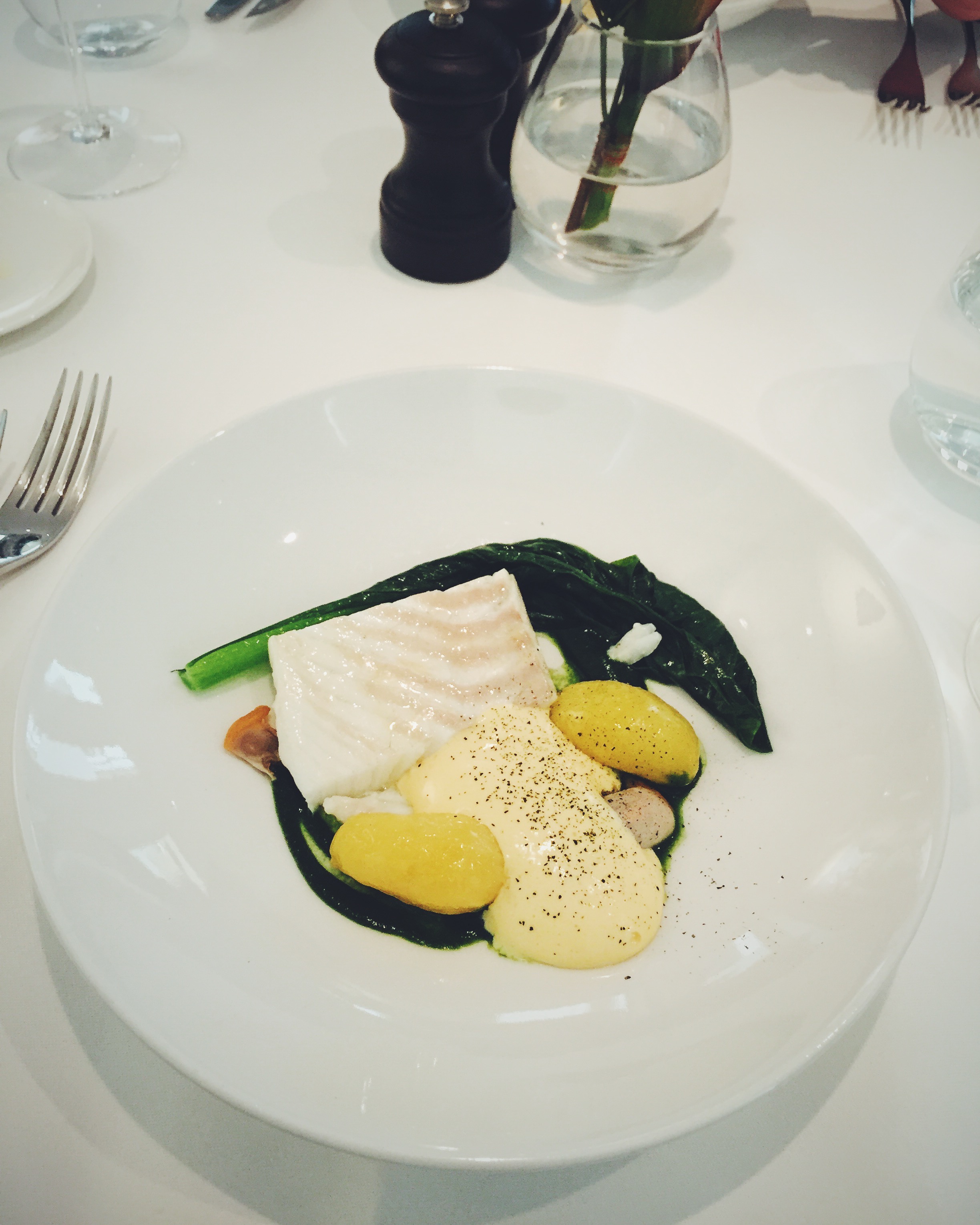Slow-cooked Cornish Turbot with Japanese mustard leaf, smoked Linzer potatoes, seaweed sabayon and cockles