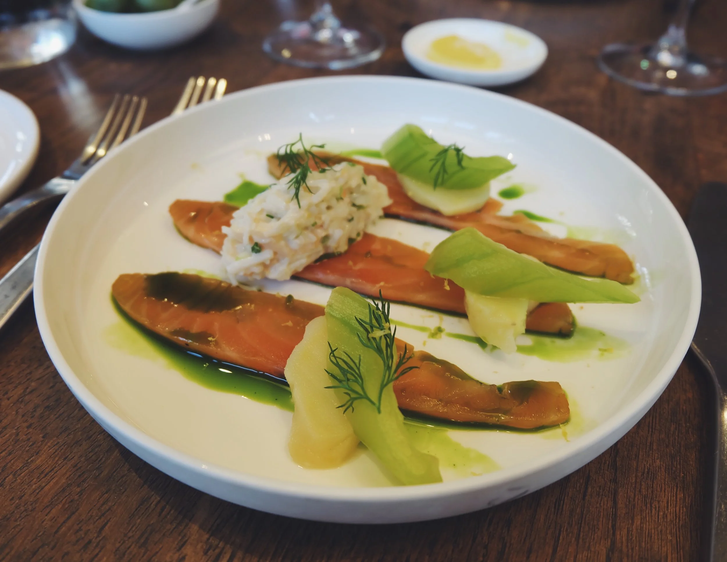 Clementine cured salmon with pickled cucumber, dressed crab and dill