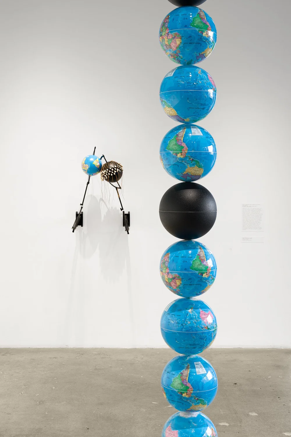 Left to right: Nolan Oswald Dennis, Articulated globe (pair), 2024; model for endless column (braced), 2021-24