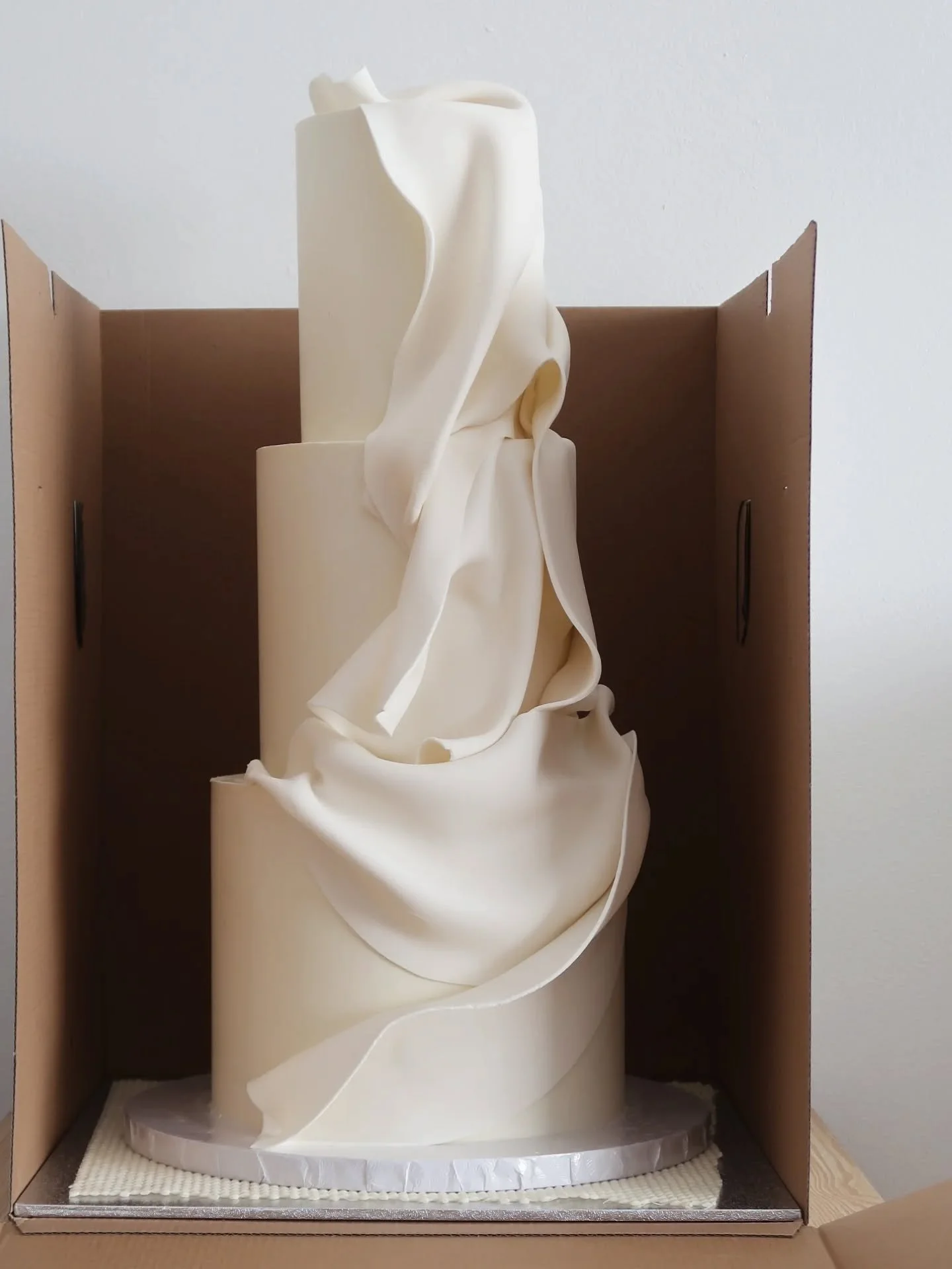 Fondant draping pictured just prior to and following delivery! So much complexity in a simple design -quickly becoming one of my most requested cake designs.