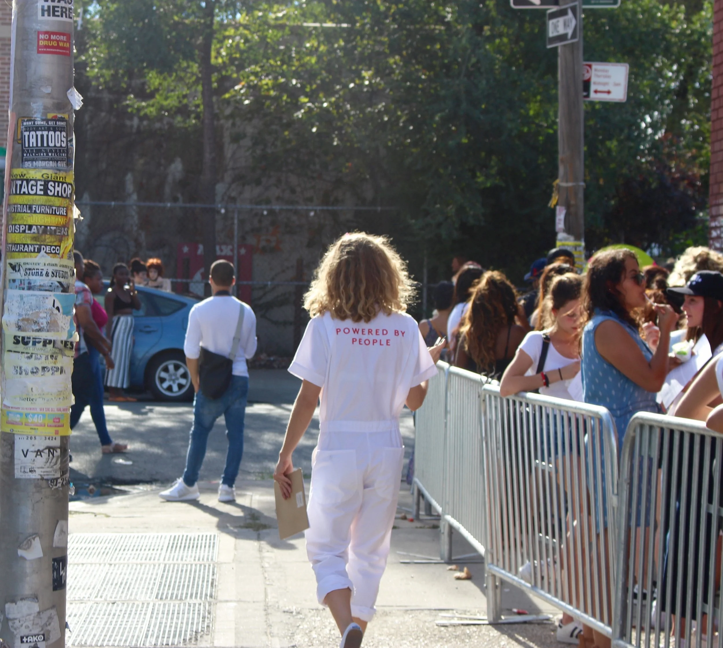 Refinery29 team member passing out forms to participants