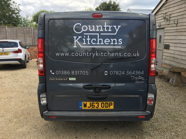 Country Kitchens van - Back view with logo and phone number