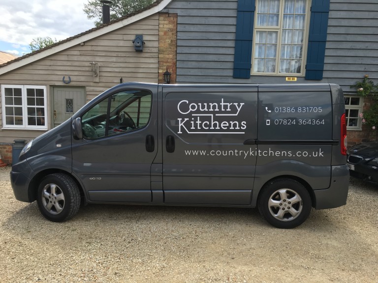 Country Kitchens van - Side view with logo and phone number